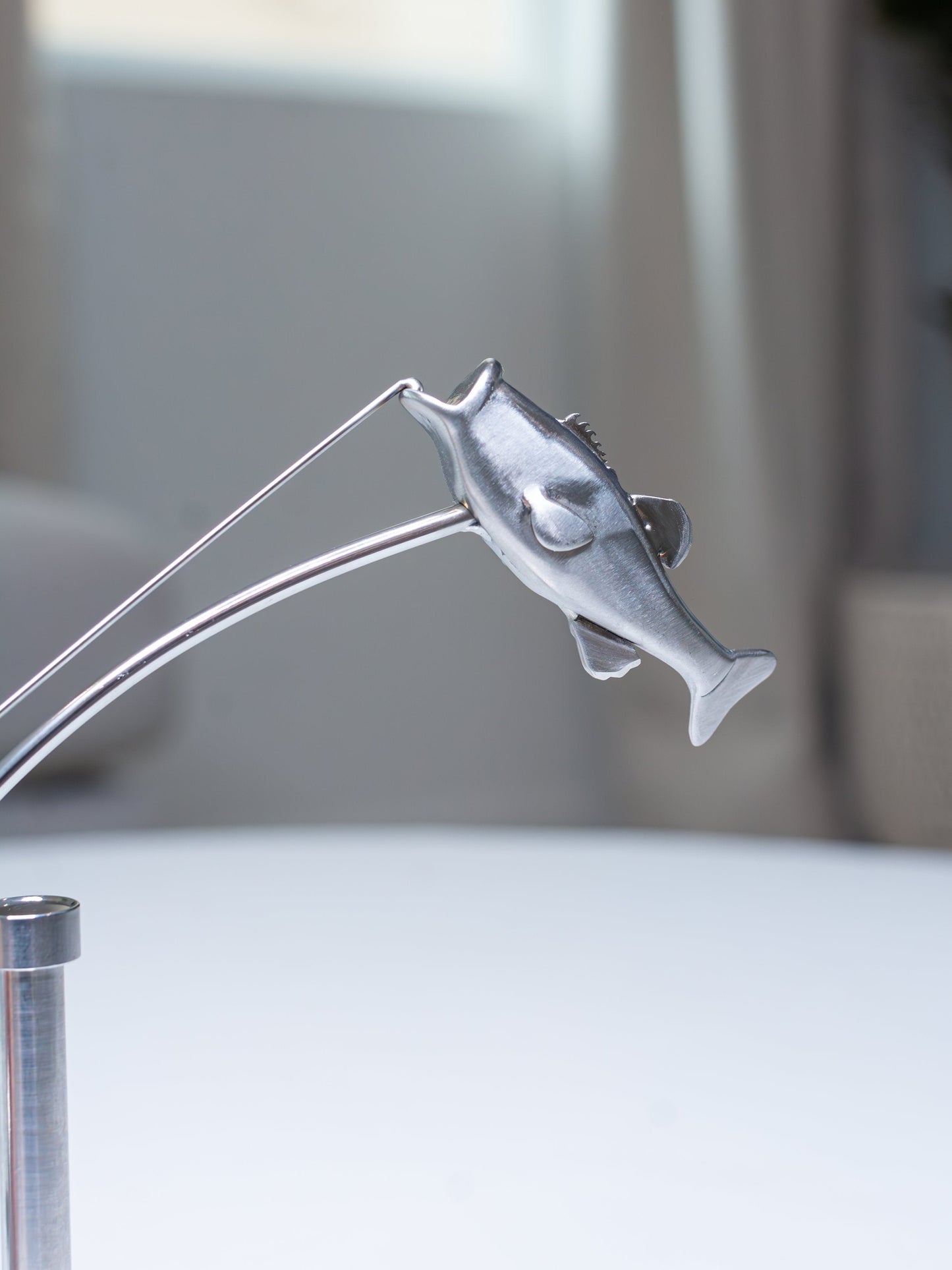 🎣Escultura del pescador en equilibrio