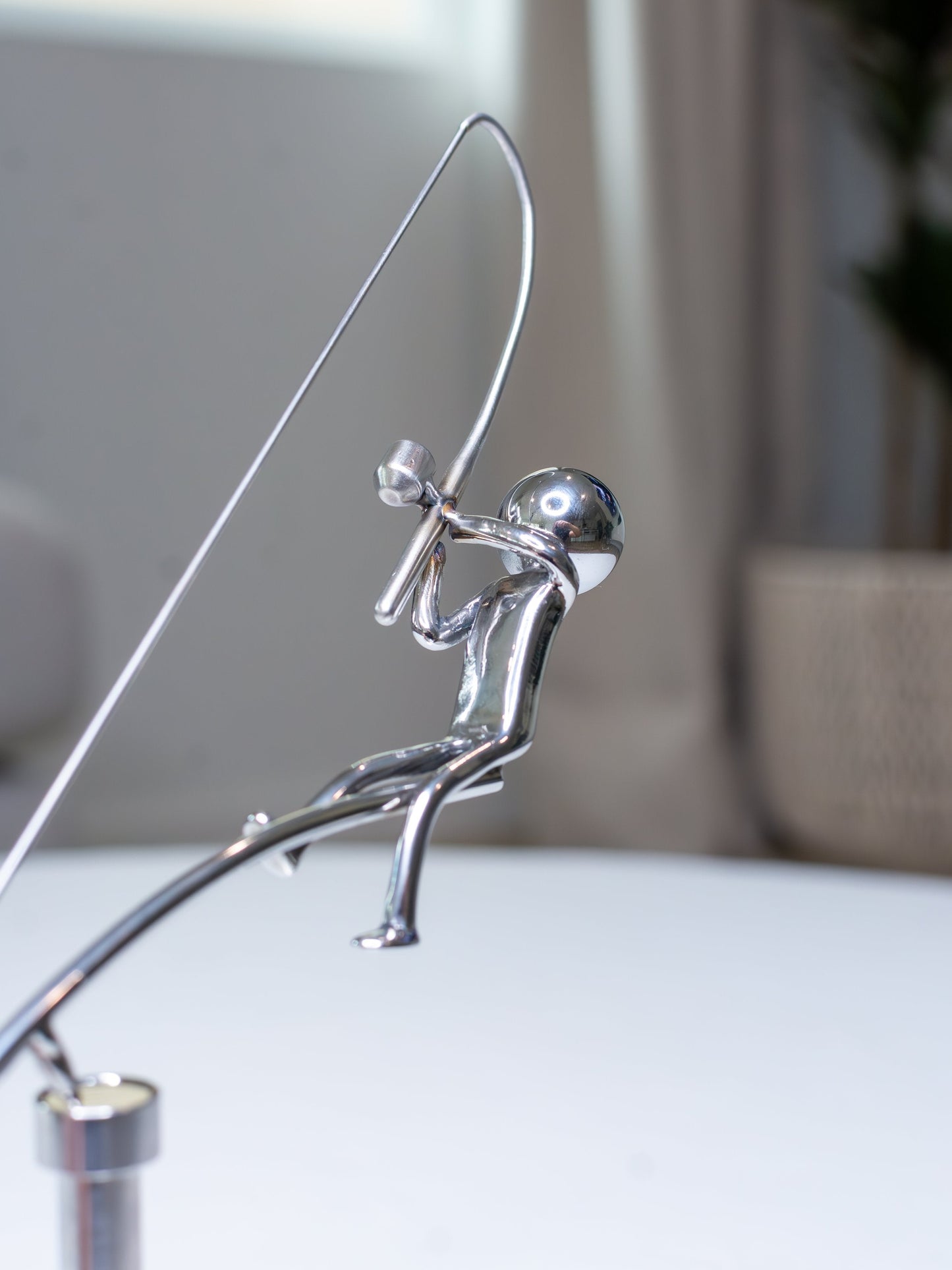 🎣Escultura del pescador en equilibrio