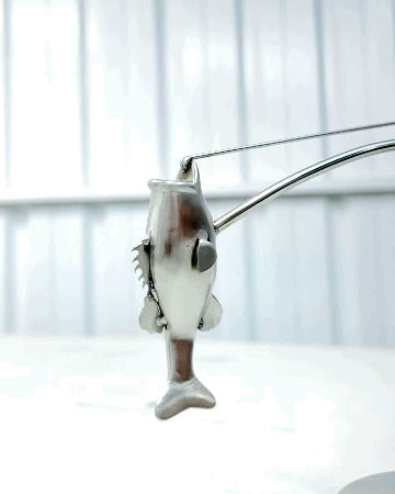 🎣Escultura del pescador en equilibrio