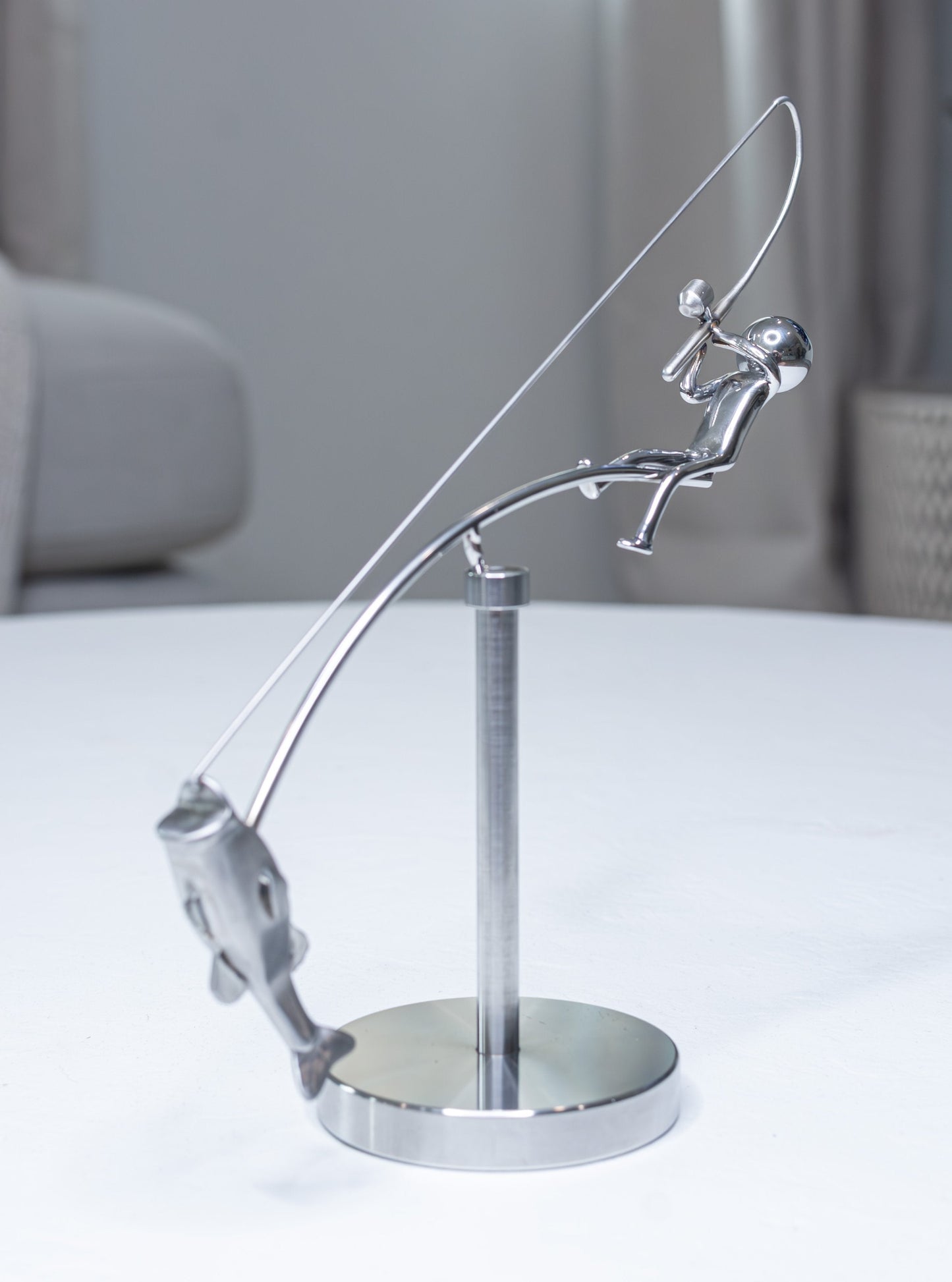 🎣Escultura del pescador en equilibrio